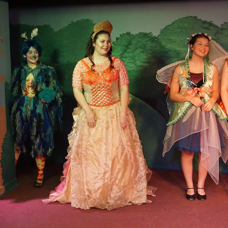 young actors dressed as a queen, fairies and a monster